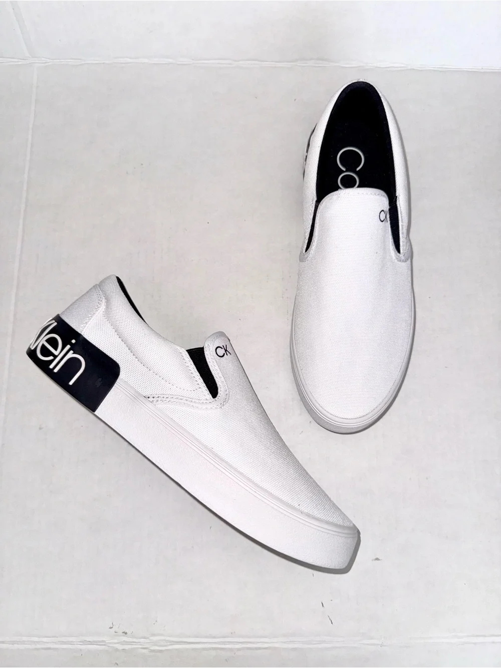 Calvin Klein White Canvas Slip-On Loafers with Black Heel Logo Accent